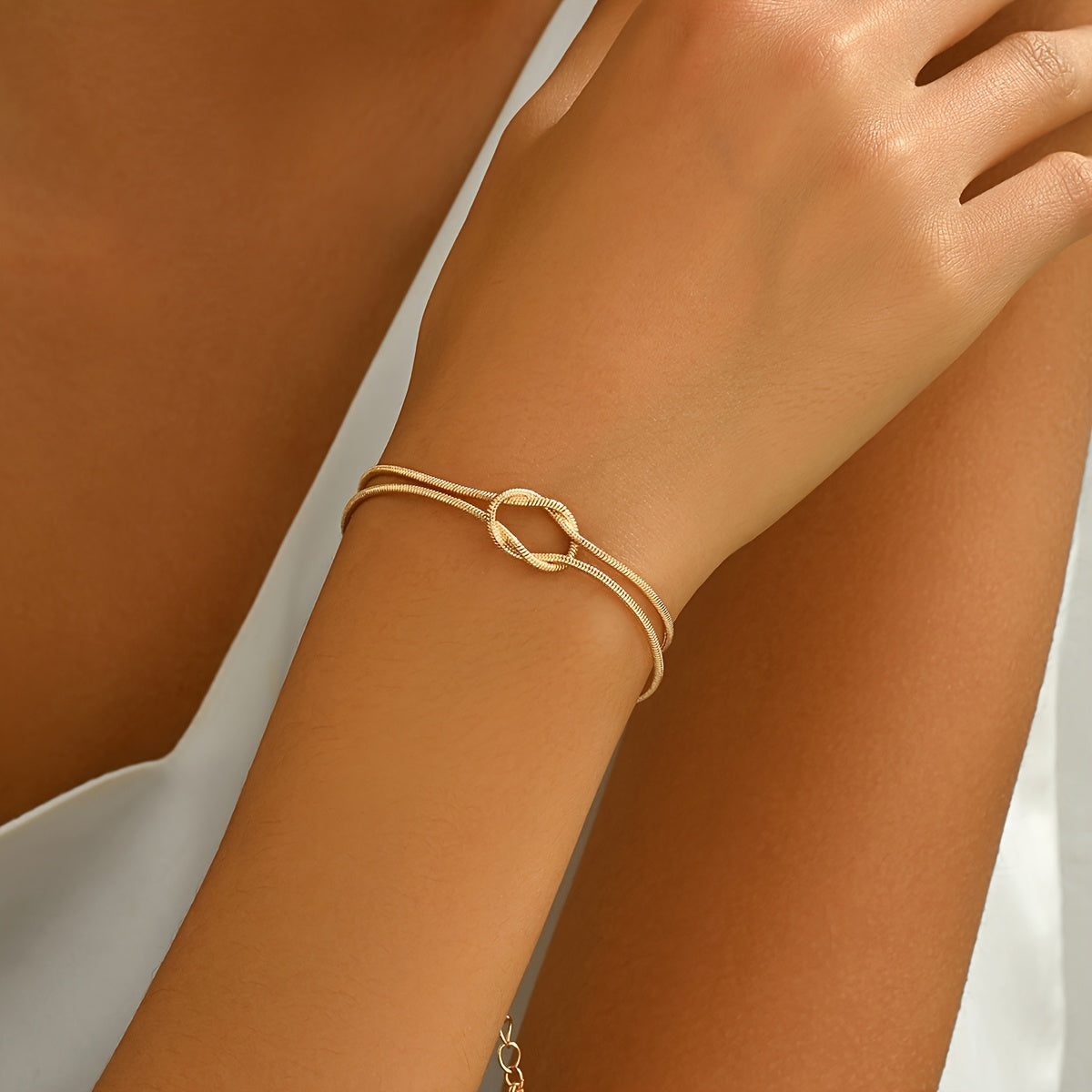1 pulseira nova de osso de cobra com nó, perfeita para uso diário para mulheres, com um design em estilo de casal