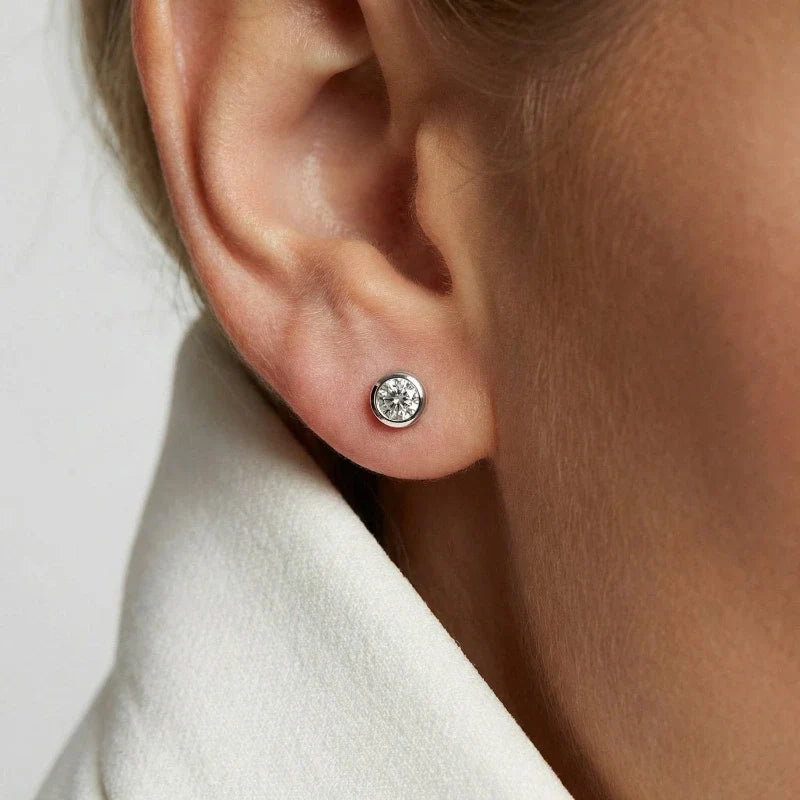 Amara Crystal Stud Earrings worn on ear – Silver