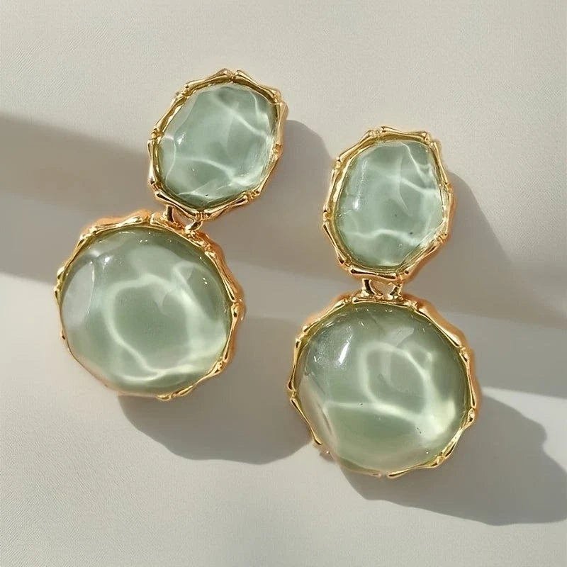 Bali Oval Resin Drop Earrings worn on wrist – Green