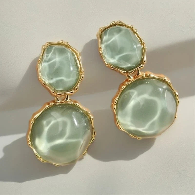Bali Oval Resin Drop Earrings worn on wrist – Green detail