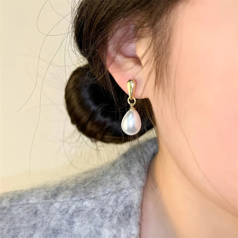 Sorella Pearl Drop Stud Earrings worn on ear