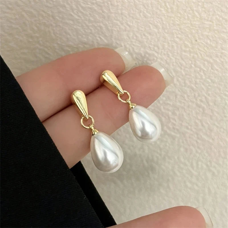 Sorella Pearl Drop Stud Earrings detail in hand