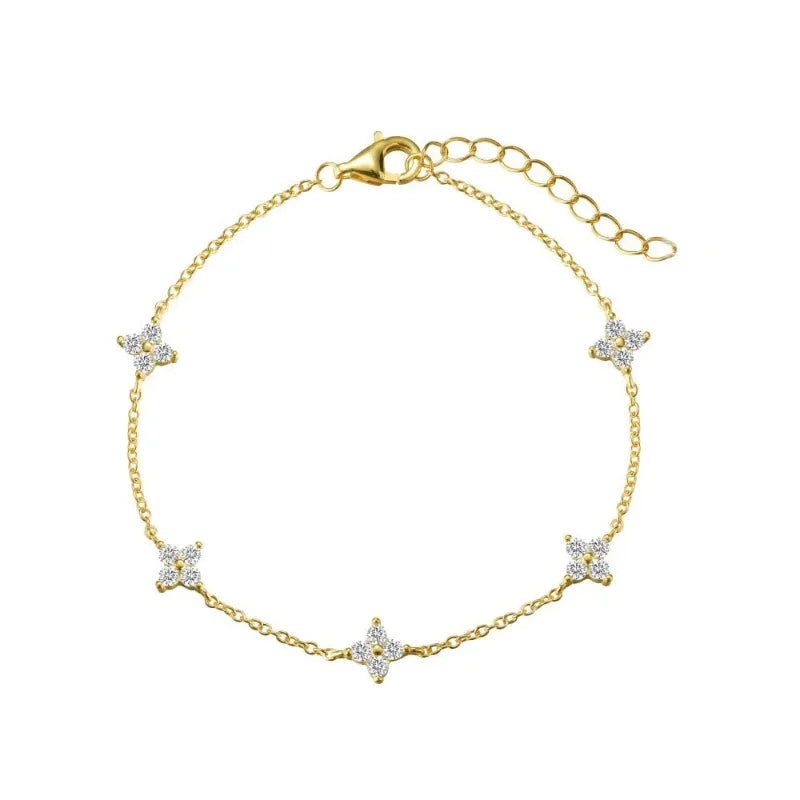Fiora Crystal Blossom Bracelet in gold with crystal floral charms, on white background