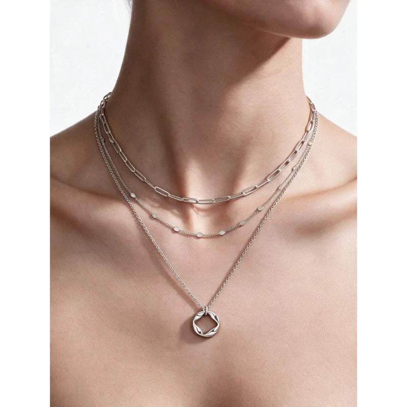 Model wearing Celeste Layers silver necklace set
