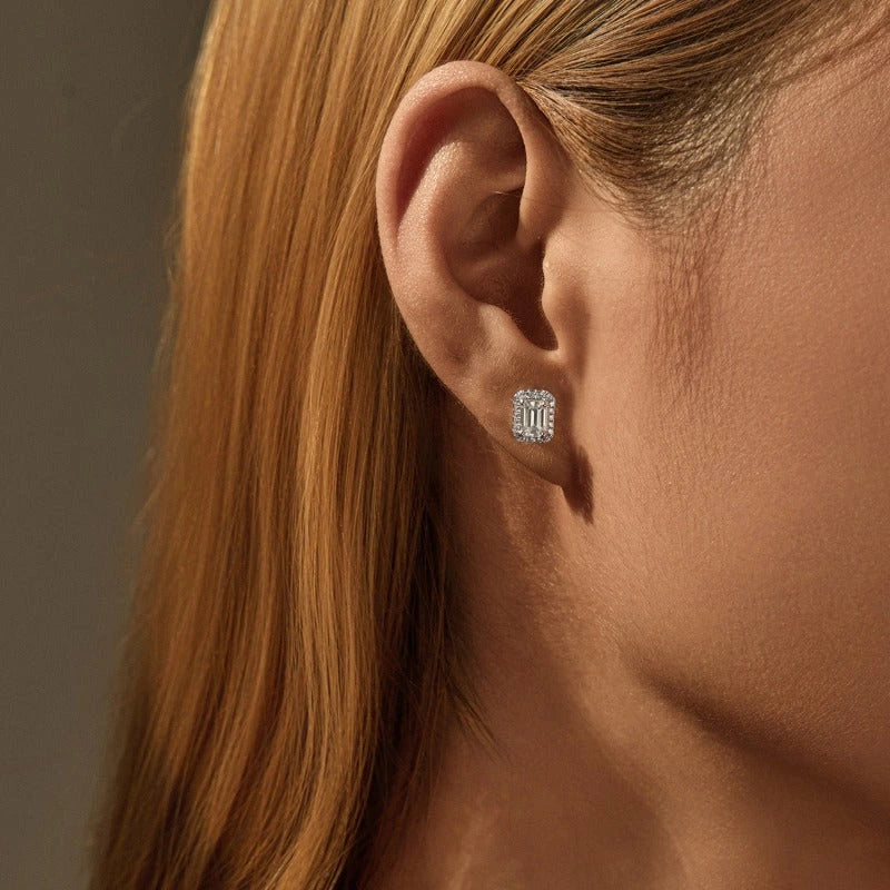 Model wearing Elysia emerald halo stud earring