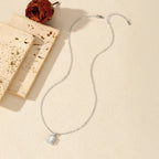 Elysia emerald halo necklace pendant and chain detail