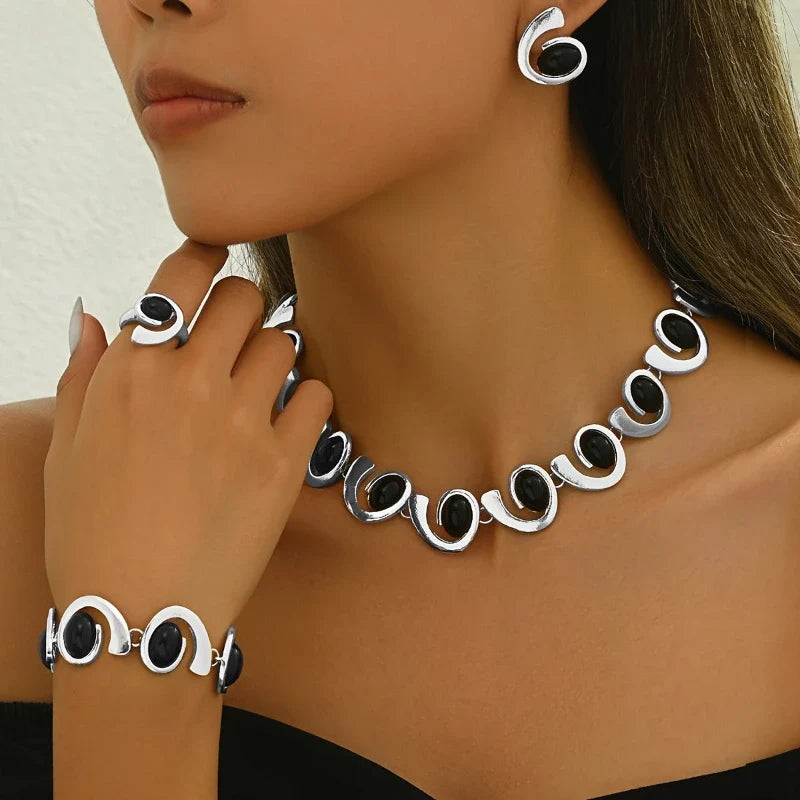 Model wearing Noir Éclipse earrings and necklace together