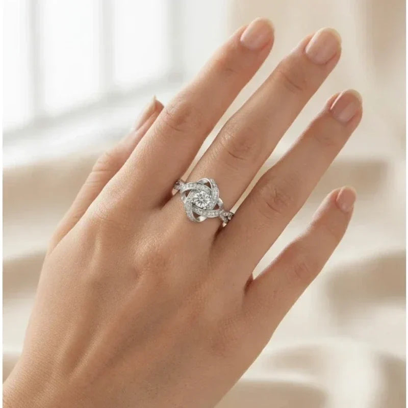 Women's Rings – Selene Love Knot Ring, silver finish, worn on hand, lifestyle image