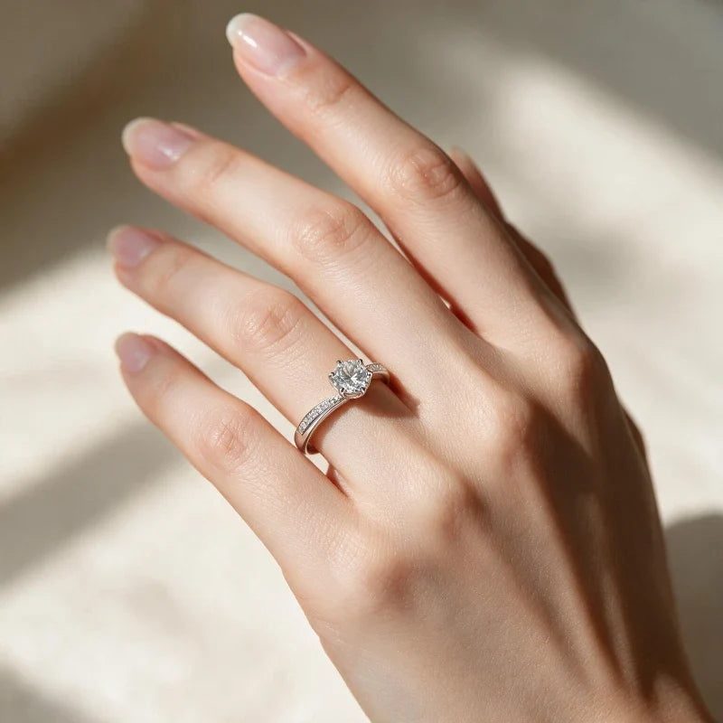 Women's Rings – Talia Twisted Solitaire Ring, silver finish, worn on hand, lifestyle image